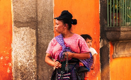 Woman with child in the street of Antigua, Guatemala.